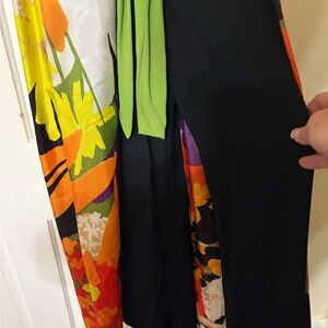 Vintage. Late 1970s. It’s a pantsuit with a cover makes it look like a dress.